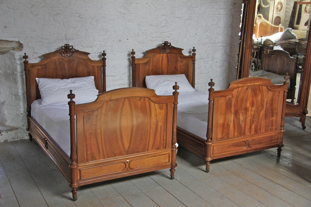 Pair of French Louis XV1 style solid  walnut beds 