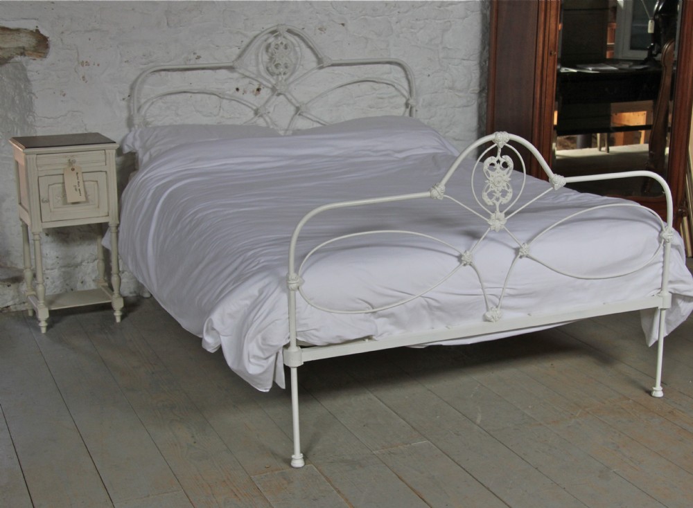 Pretty early all iron king size aged white bed 