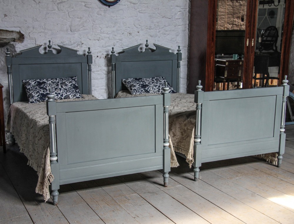 Pair of single painted French Empire style beds