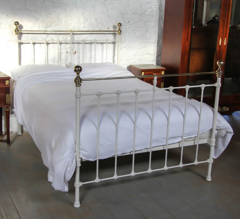 Classic Victorian white and brass double bed.
