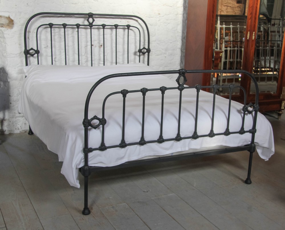 Hand finished in black simple attractive all iron king size 