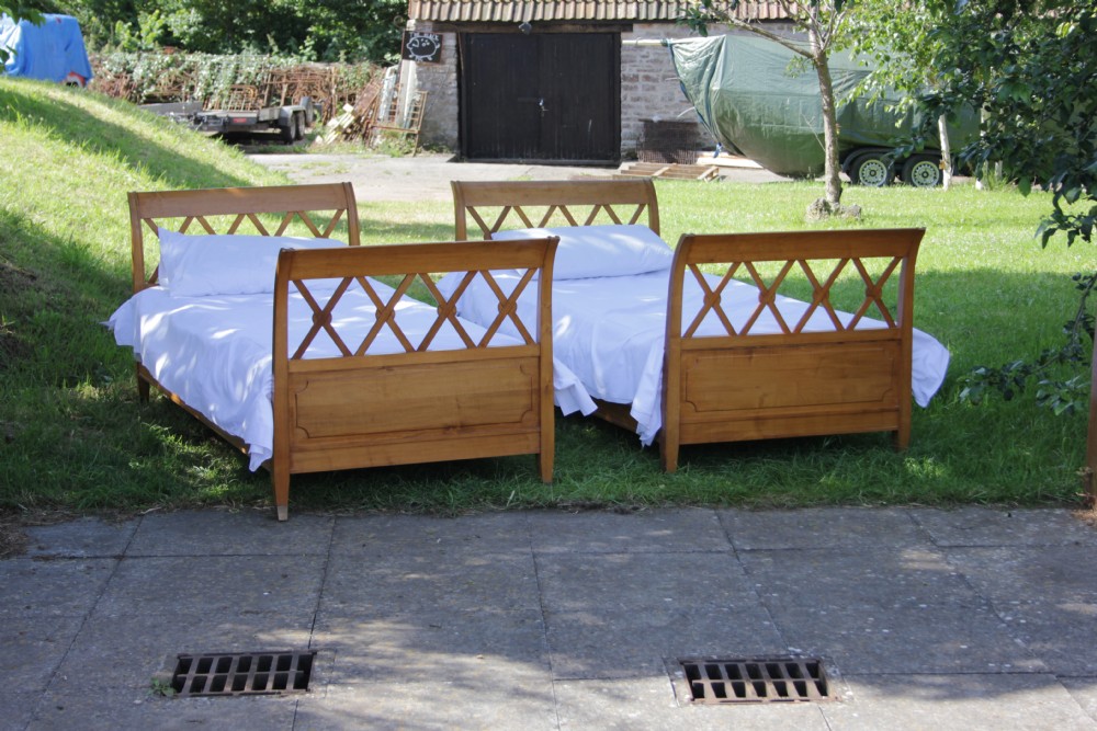 Pair of French cherry single latticed sleigh beds