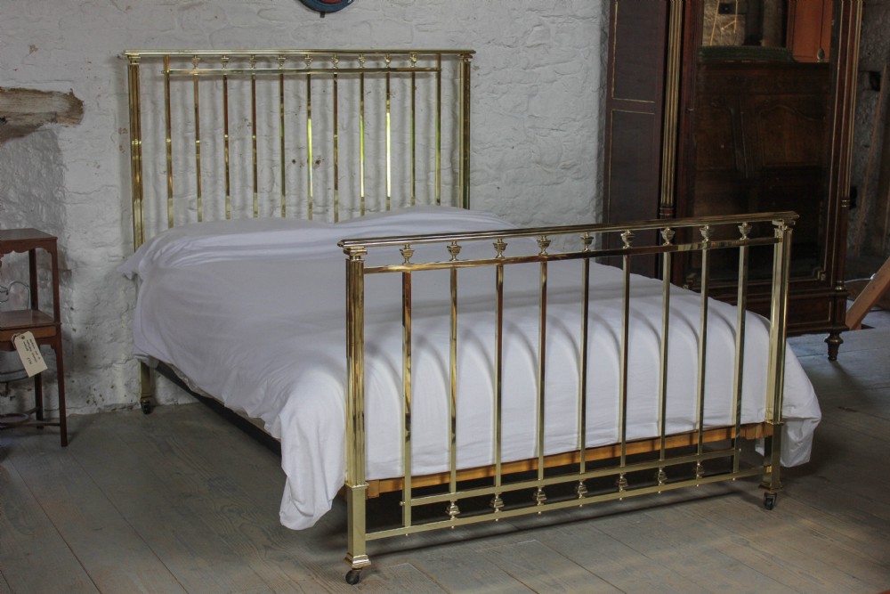 Very good quality polished and lacquered large king size solid brass bed