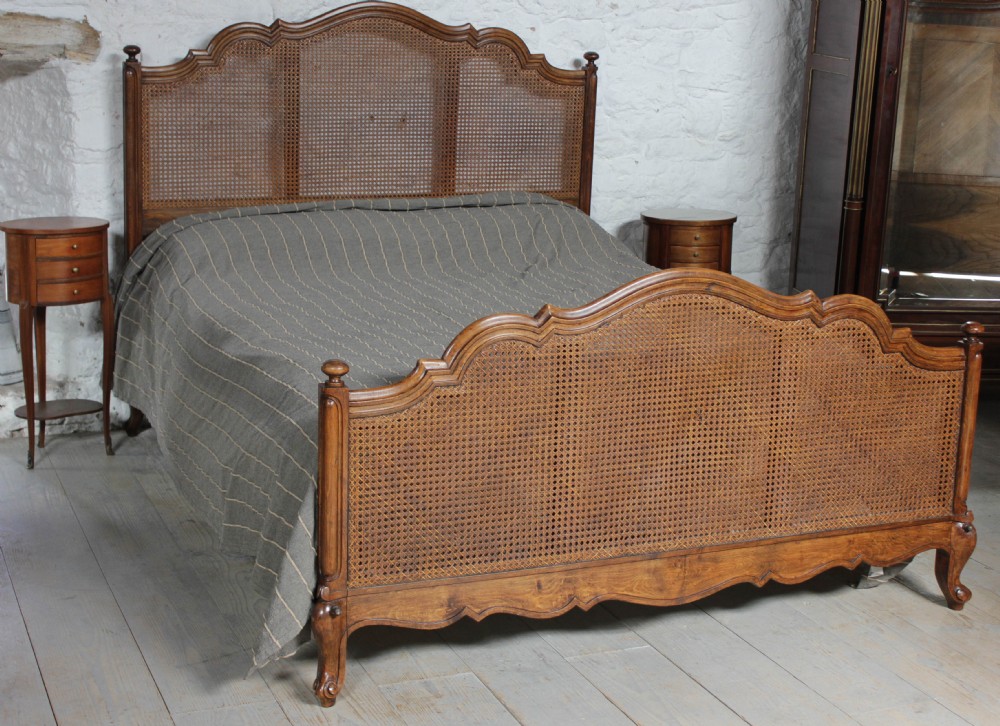 Very attractive Louis XV style walnut large king size caned French bed
