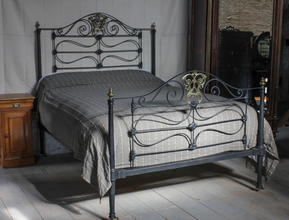 Striking Early Victorian black and brass king size