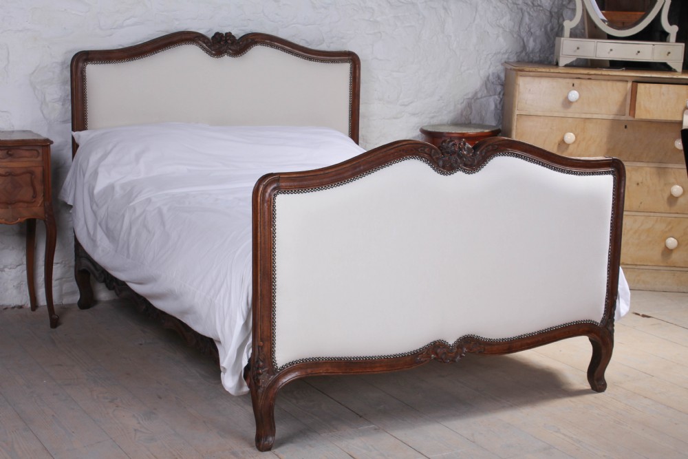 Early walnut framed French double upholstered bed