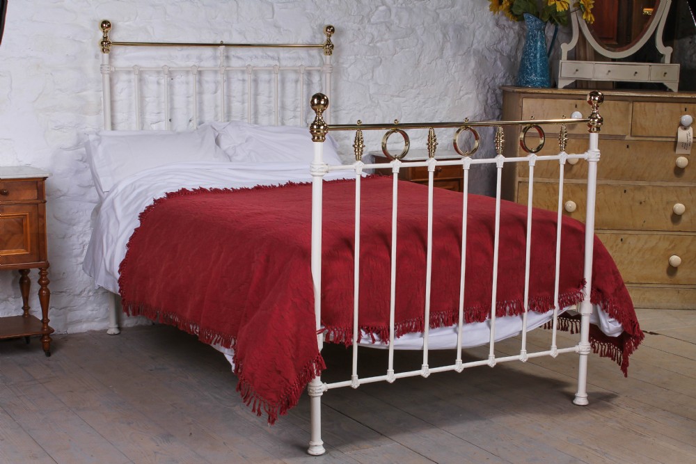 Pretty three quarter white and brass bed