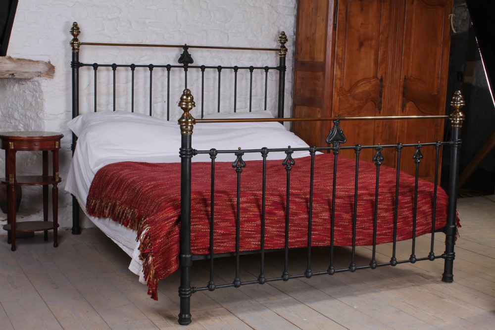 Handsome Art Nouveau detail aged black and brass 6ft bed