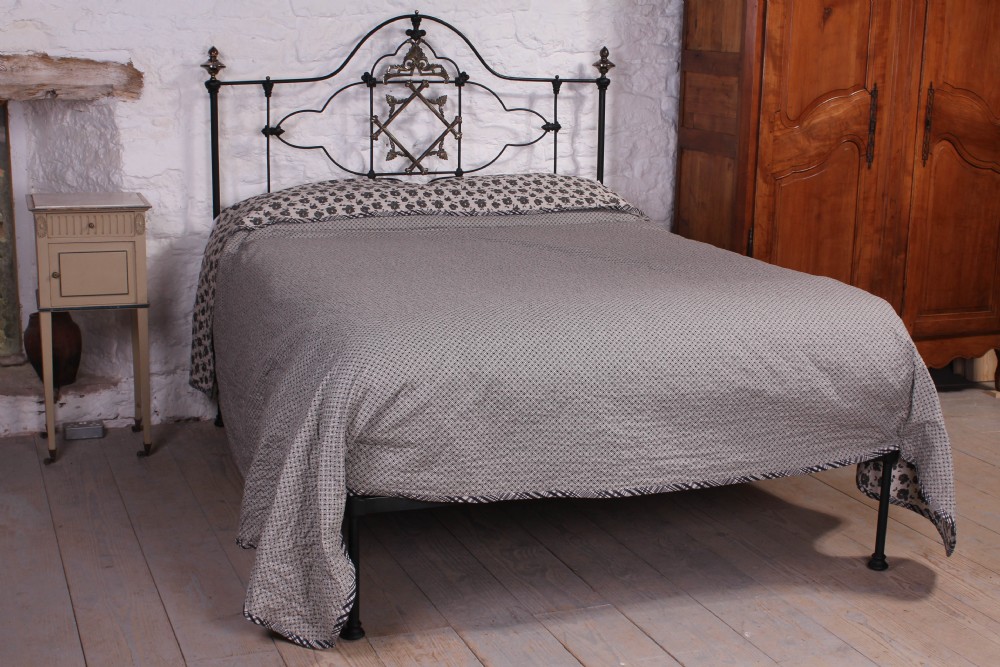 Extraordinarily lovely and individual 5Ft king size black and brass no end bed