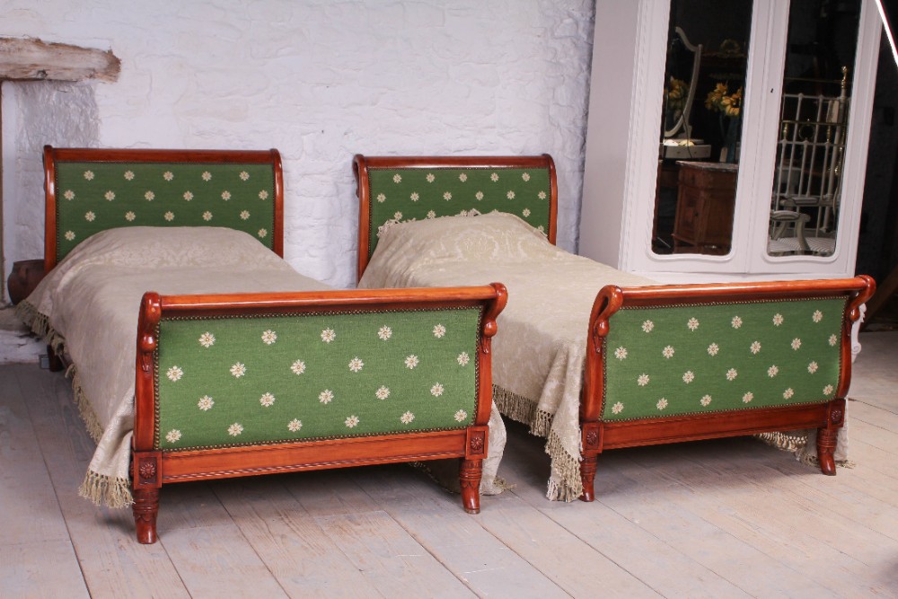 Pretty pair of single cherry swan detail upholstered beds