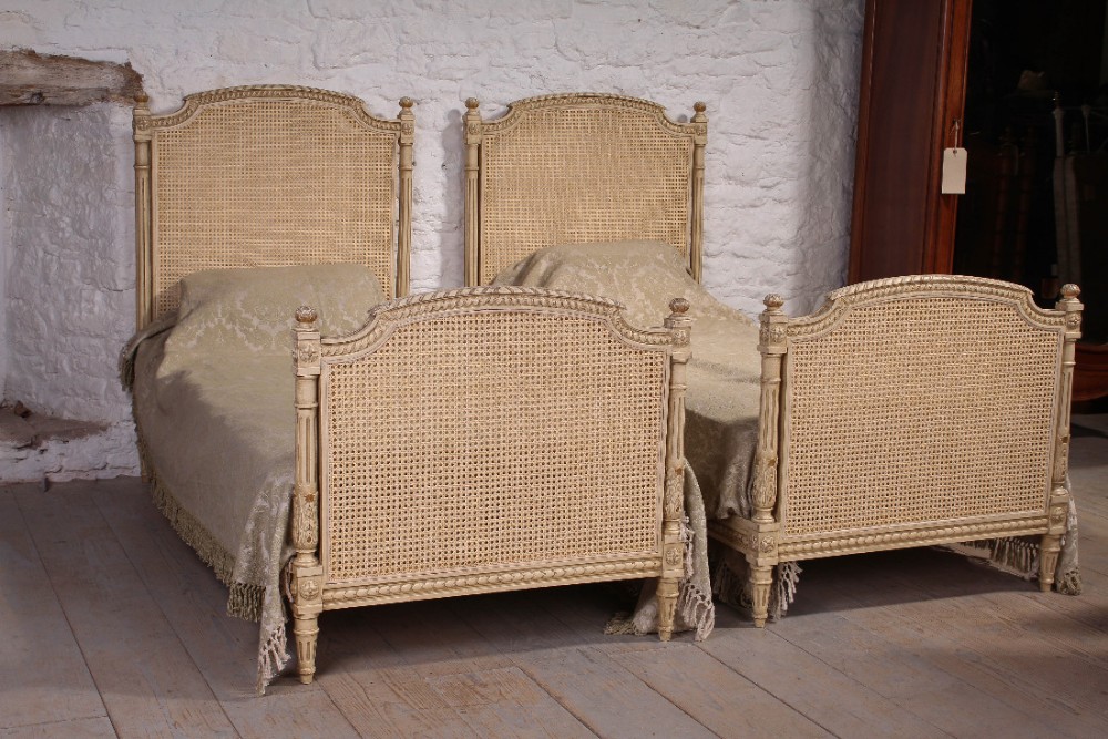 Pretty pair of Louis XVI style single painted caned beds
