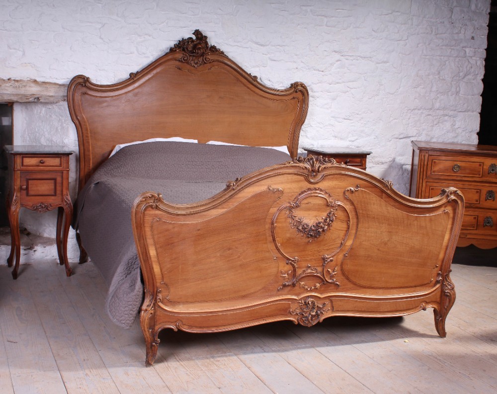 Solid walnut large king size Louis XV style finely carved bed