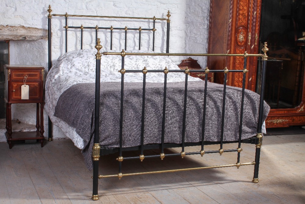 Attractive Victorian black and brass king size bed