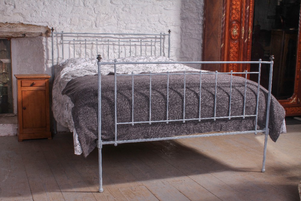 Exquisitely simple early 5Ft king size forged iron bed