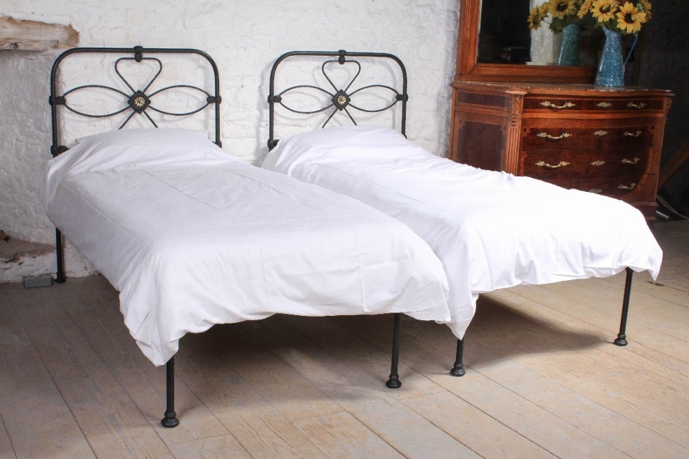 Pair of Irish single black no end beds