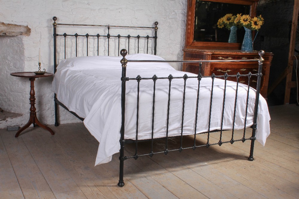 Classic Victorian black and aged brass king size bed