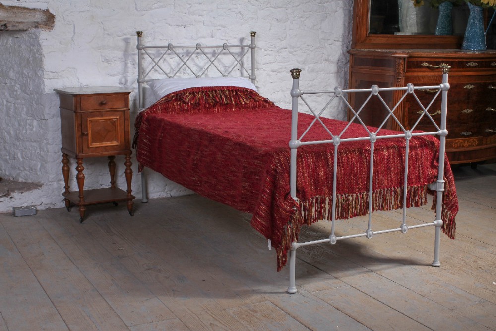 Attractive individual single iron and brass bed