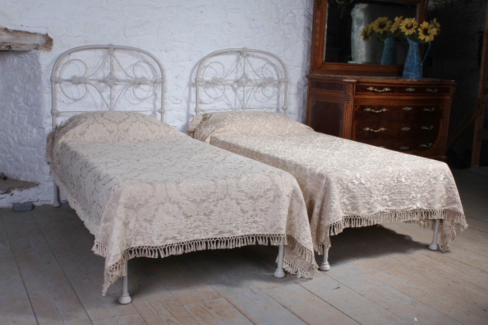 Pretty pair of iron single no end beds