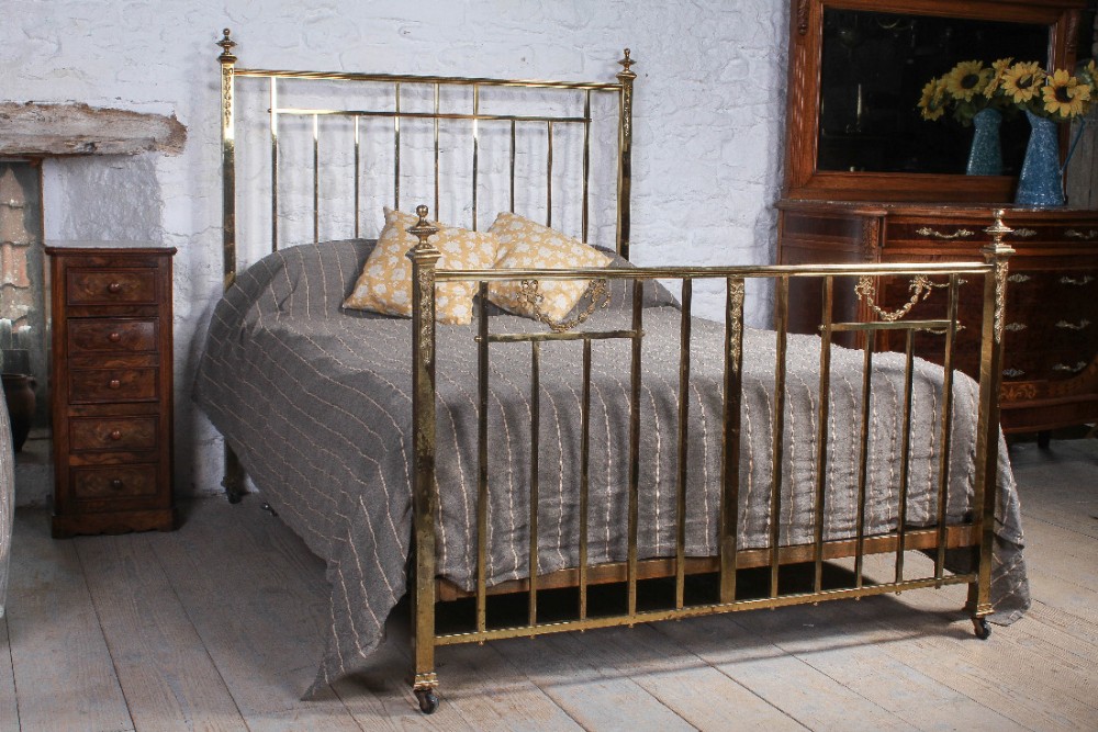All original and individual King size French all brass bed with classic French garland and floral decoration
