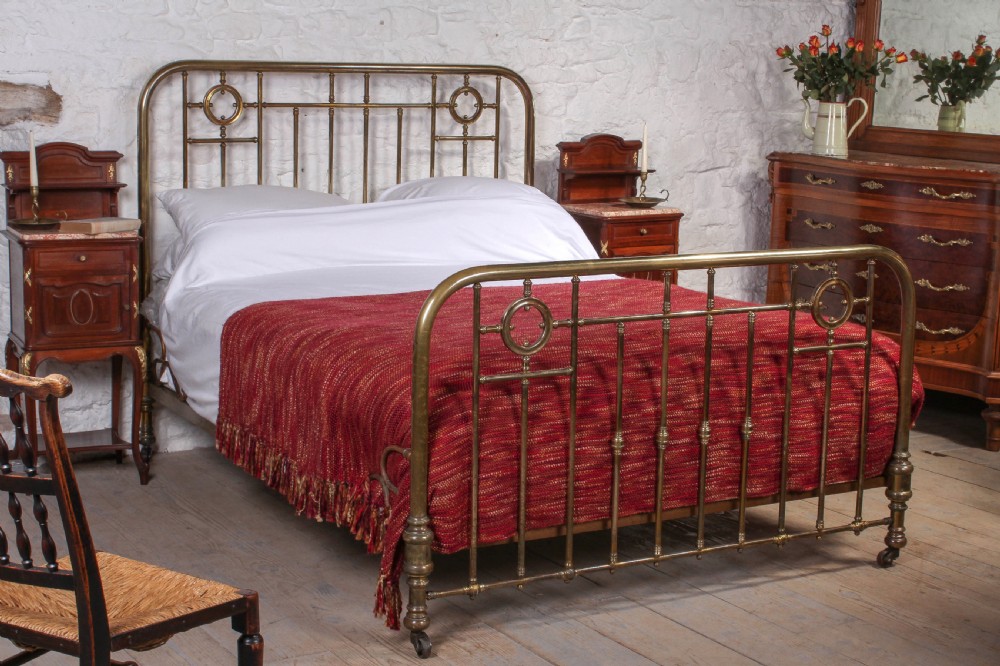 Lovely naturally aged individual and simple brass French king size bed with brass ring detail