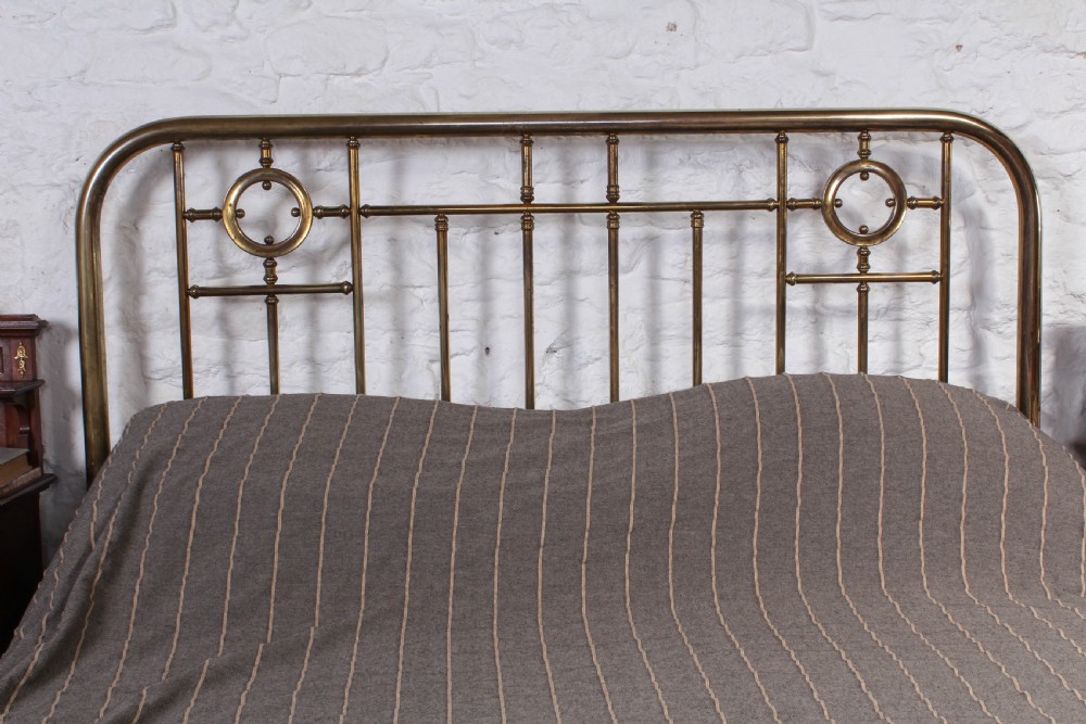 Lovely naturally aged individual and simple brass French king size bed with brass ring detail View VI
