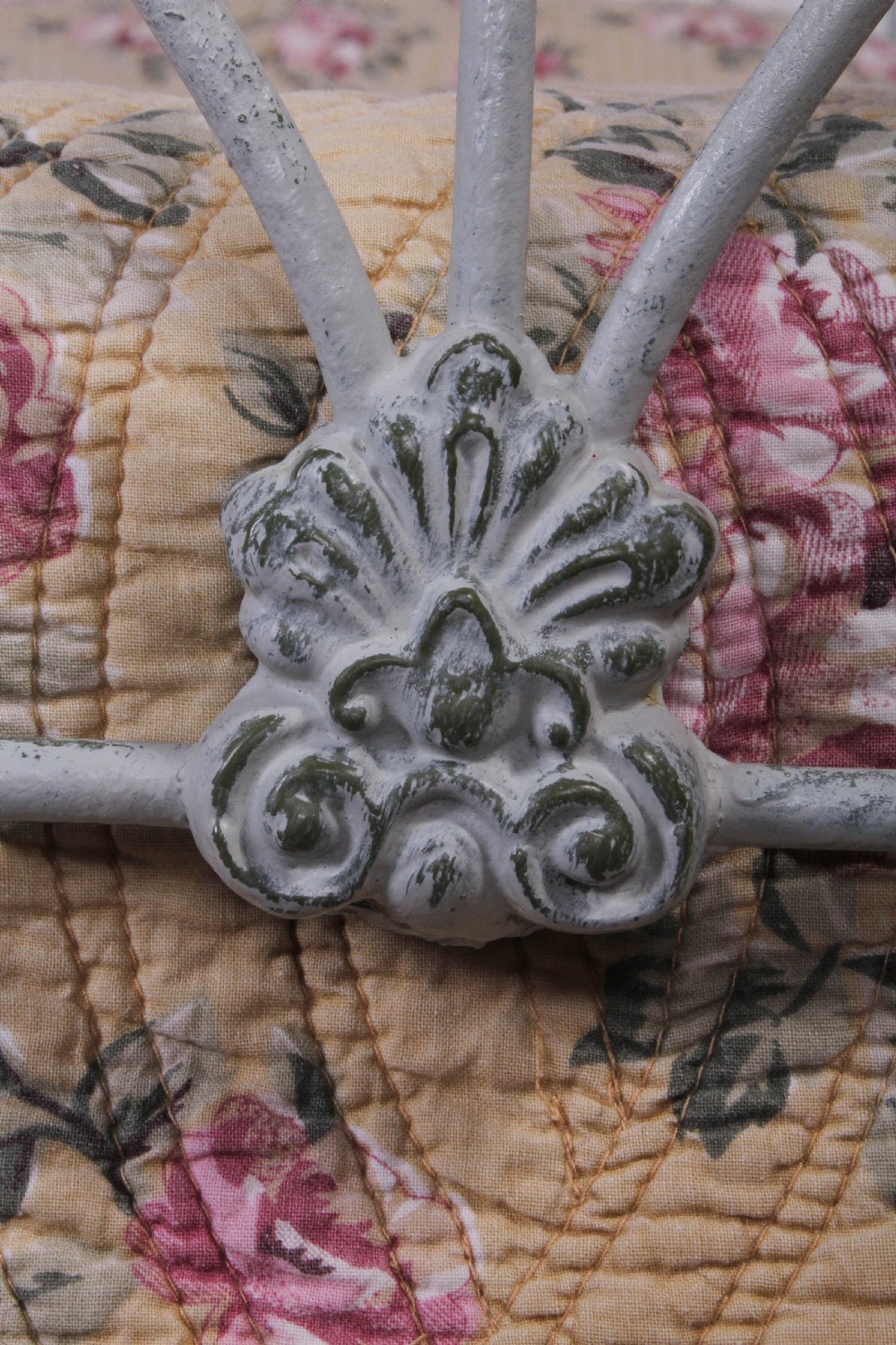 Pretty hand finished single iron bed with porcelain knobs View VII