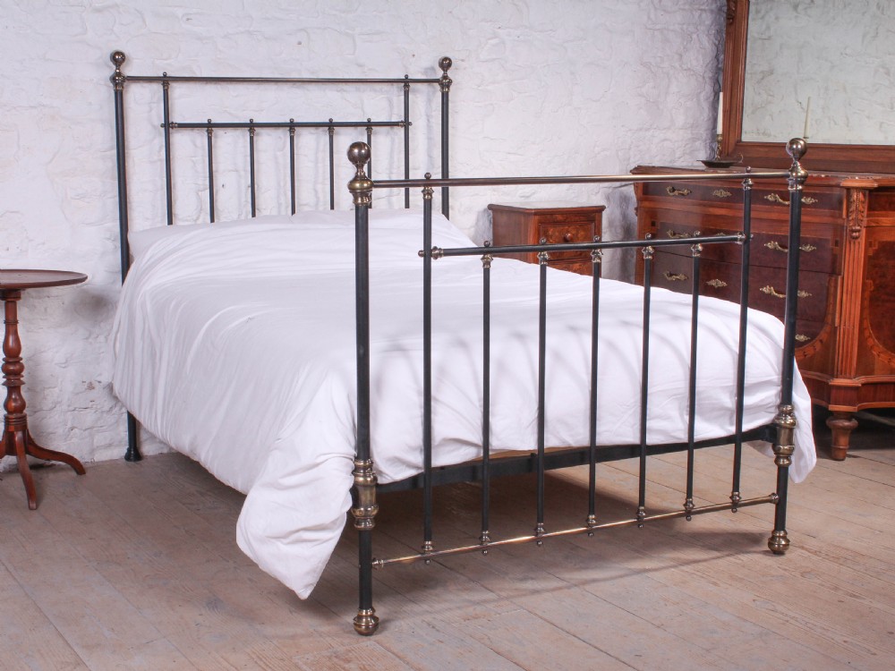 Lovely classic Victorian black and aged brass double bed