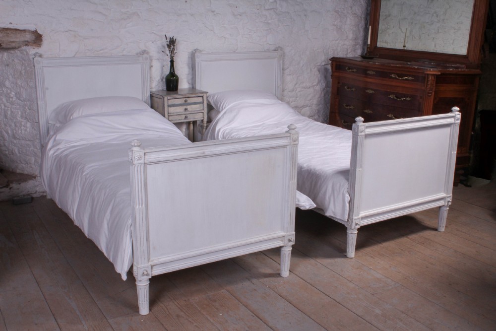 Pair of single French empire style painted beds