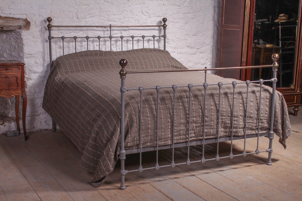 Classic Victorian grey and aged brass kingsize bed