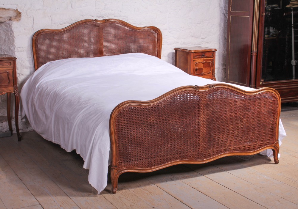 Attractive French Louis XV style caned bergere king size bed