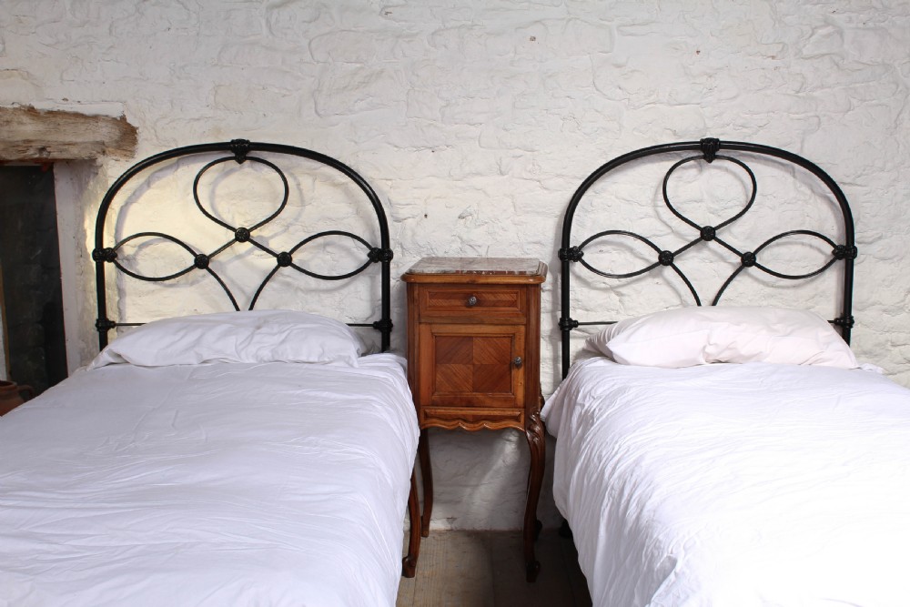 Attractive pair of black all iron no end single beds View II