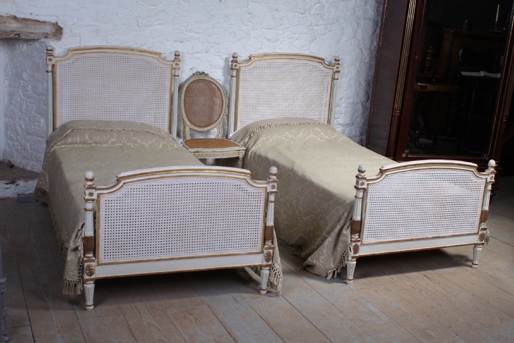 Very pretty pair of French painted caned bergere beds