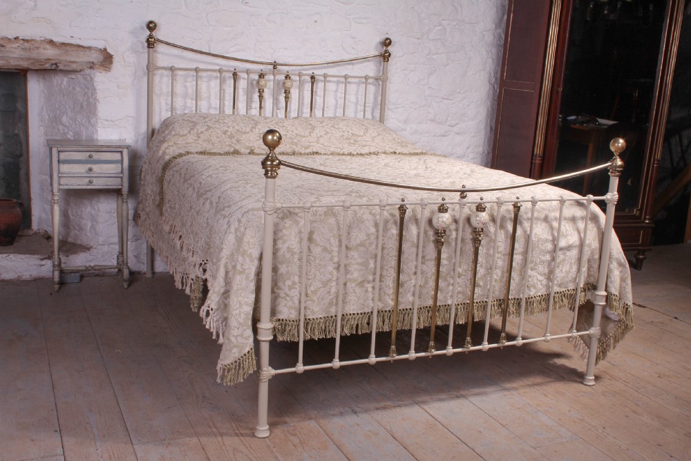 Classic Victorian dip rail bed with porcelain detail