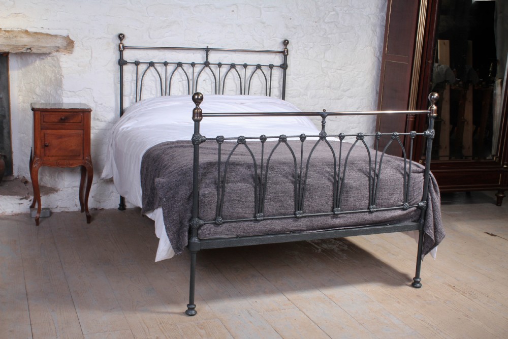 Rare and individual Victorian black and brass double bed.