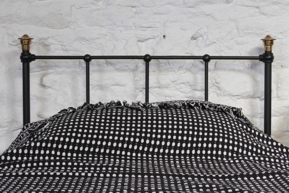 Simple attractive Edwardian black and brass single bed View V