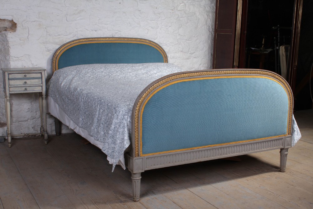 Attractive French upholstered king size bed with original gilded paint