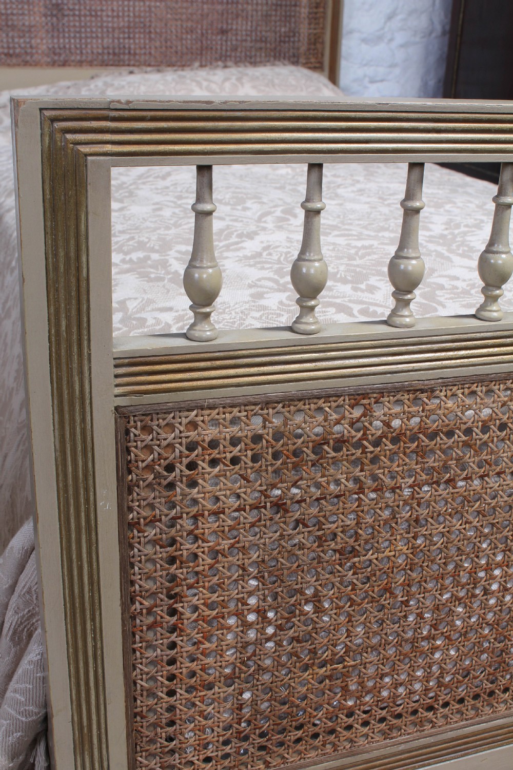 Pretty pair of French meter wide caned gilded beds View IV