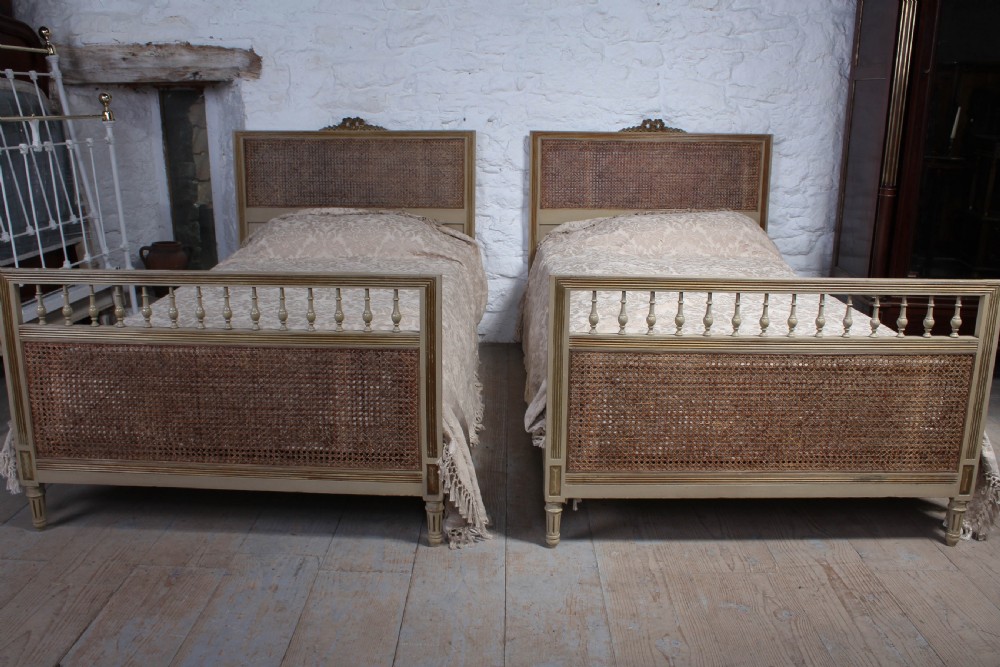 Pretty pair of French meter wide caned gilded beds View VII