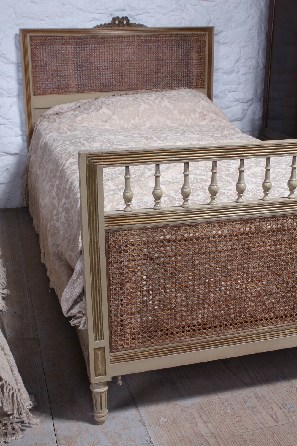 Pretty pair of French meter wide caned gilded beds View VIII