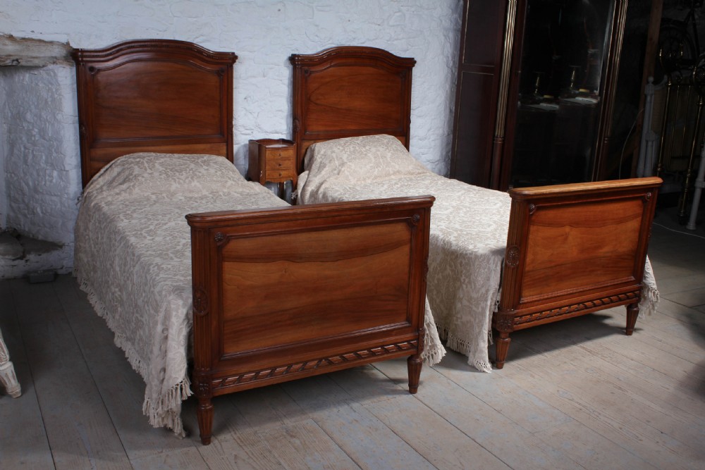 Handsome pair of French Walnut single beds View II