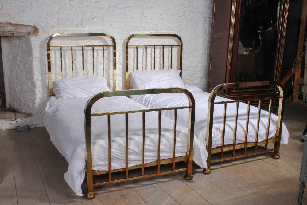 Attractive pair of simple French all brass single beds