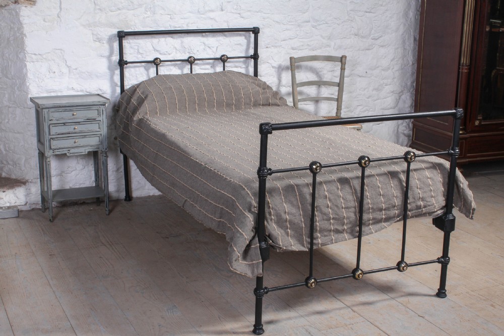 Simple black iron single bed