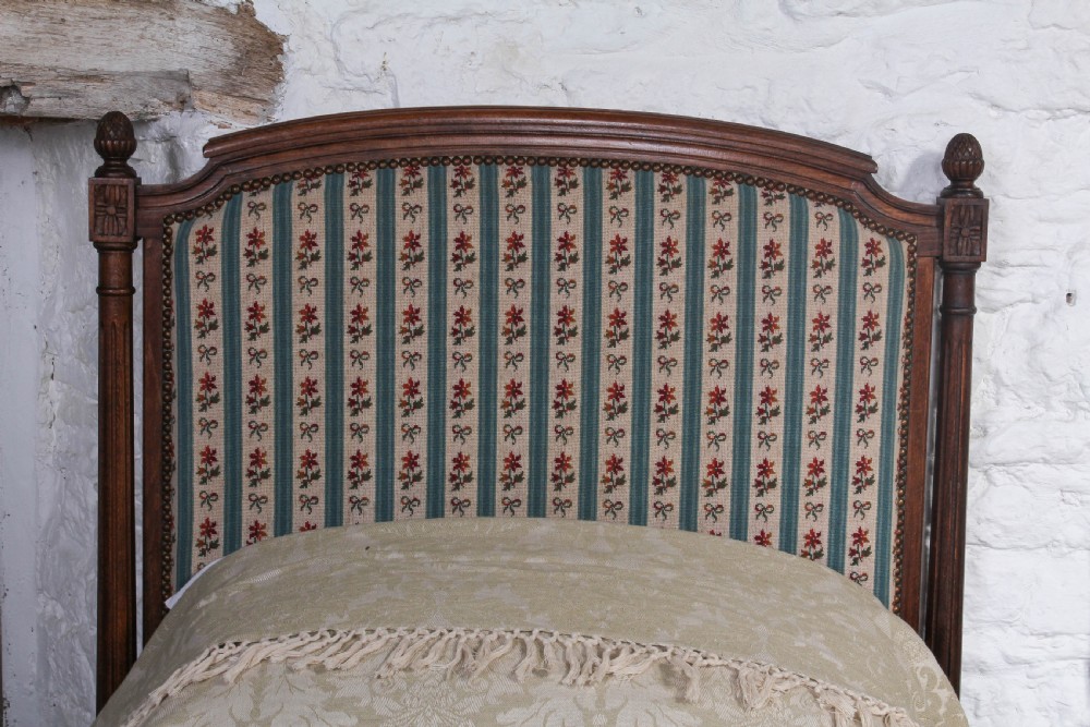 Pair of French carved oak upholstered single beds View III