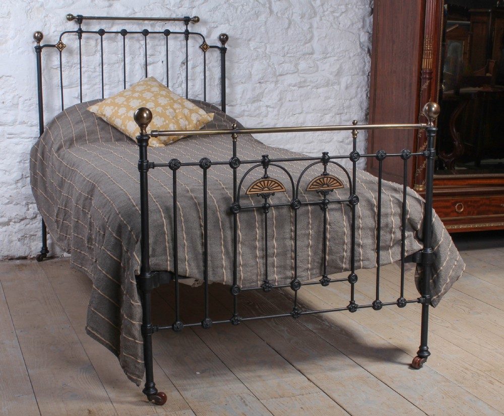 Pretty and unusual single brass and iron bed
