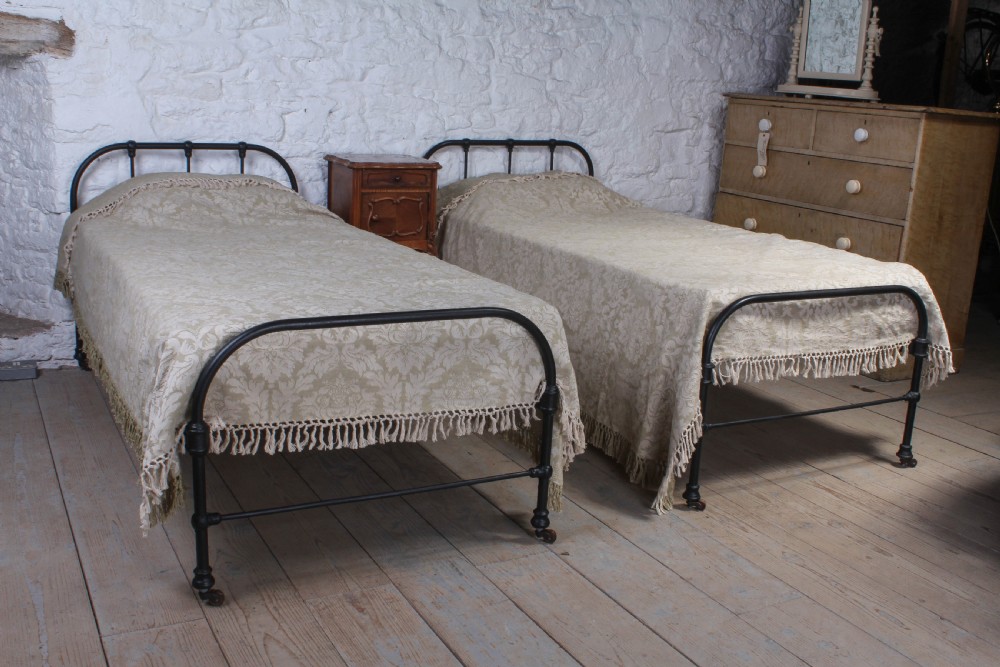 Almost pair of dorm style all iron Victorian single beds