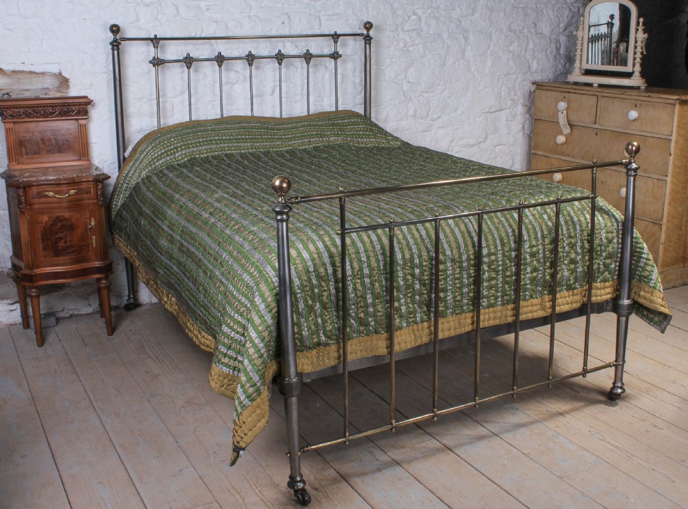 Very handsome burnished iron and aged brass kingsize bed