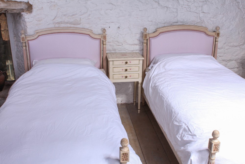 Pretty in pink pair of French newly upholstered single beds View II