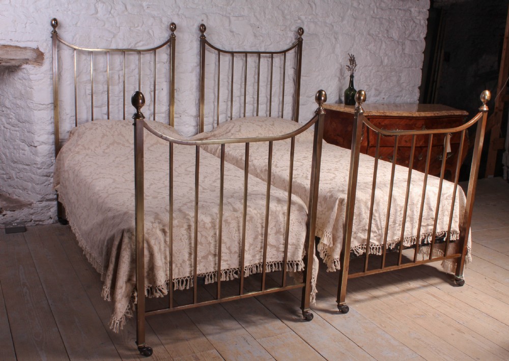 Pair of Heals Edwardian single brass beds 