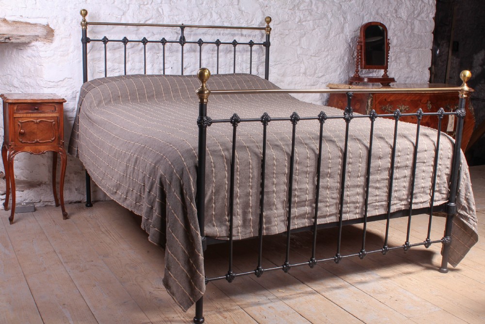 Classic Victorian black and aged brass king size bed
