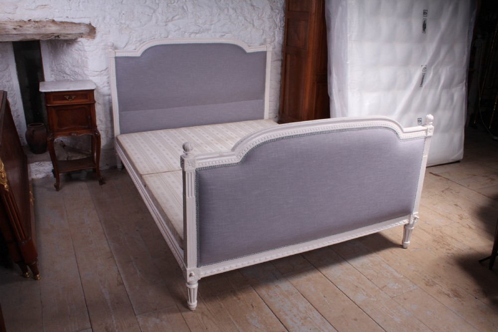 Carved frame newly upholstered French Empire style king size bed View II